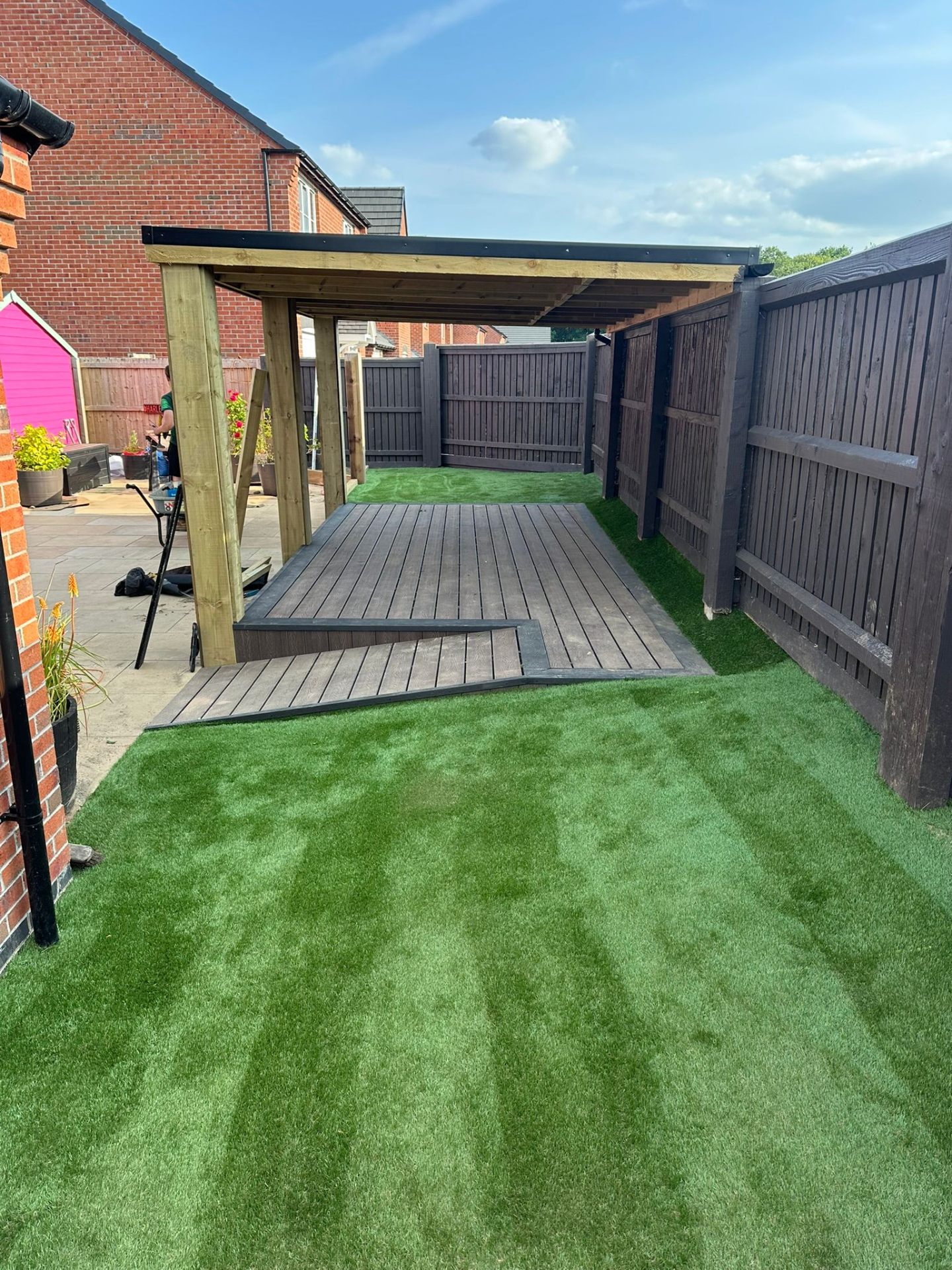 Premium artificial grass lawn with pergola walkway in a Nottinghamshire garden