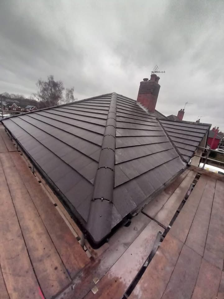 Completed natural slate hip roof replacement on a Nottinghamshire home by Sherwood Roofing